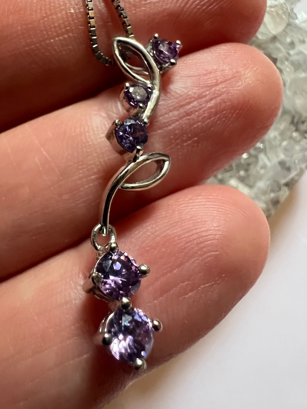 Faceted Amethyst Flower Vein pendant on a sterling silver necklace