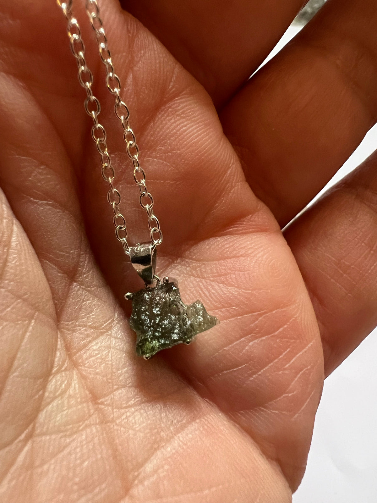 Moldavite pendant on a sterilizing silver chain necklace
