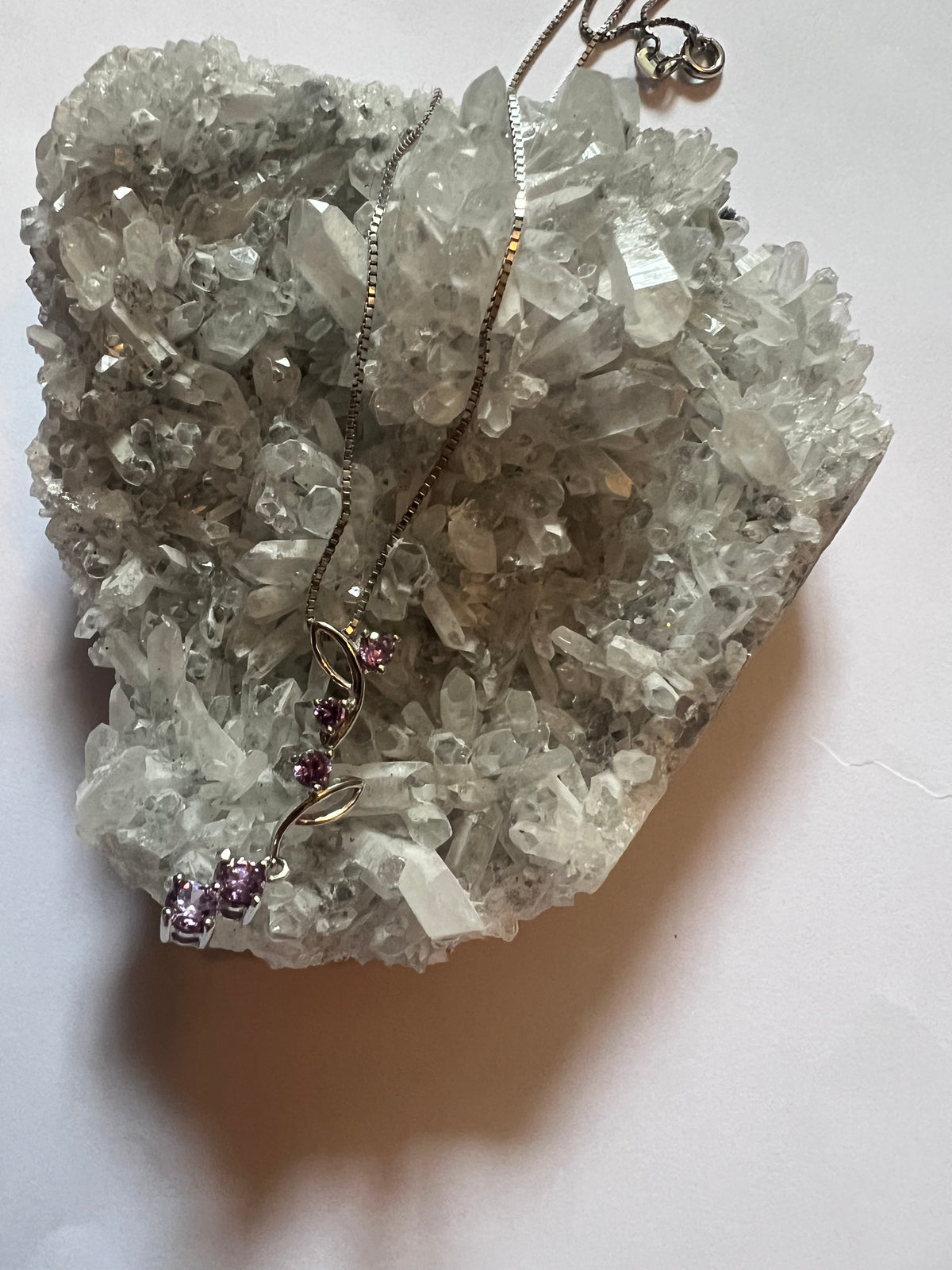 Faceted Amethyst Flower Vein pendant on a sterling silver necklace