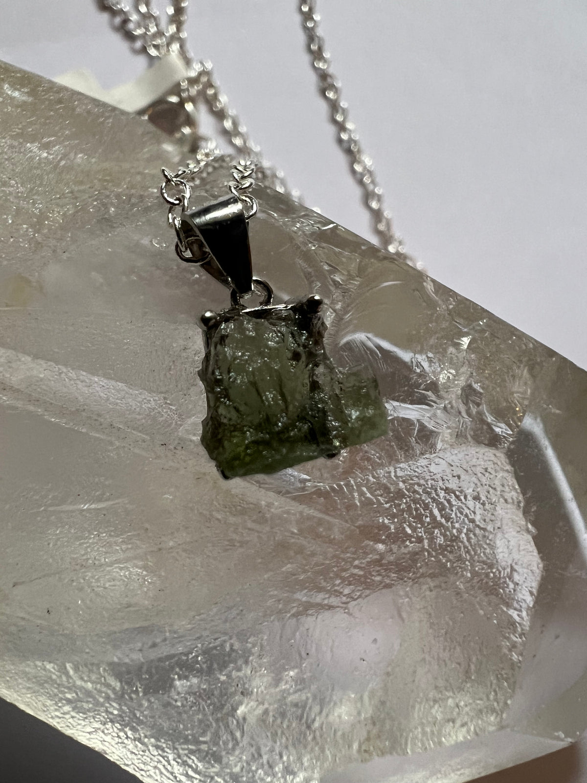 Moldavite pendant on a sterilizing silver chain necklace